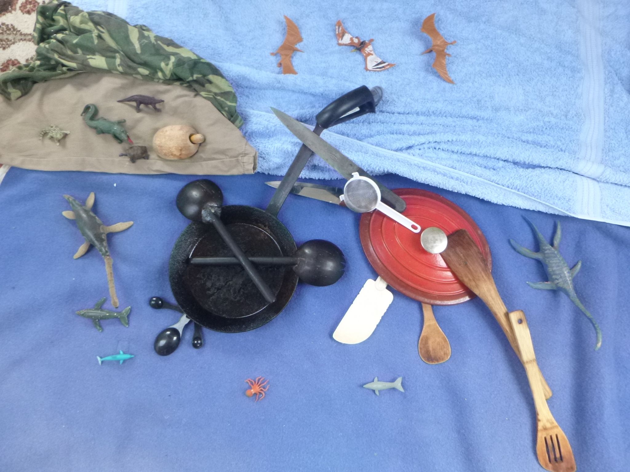 Duria Antiquior recreated using household objects including toy dinosaurs, kitchen utensils, bath toys and fabric